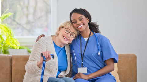 Portrait of nurse and senior woman